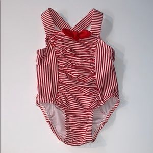 red and white candy cane striped swimsuit